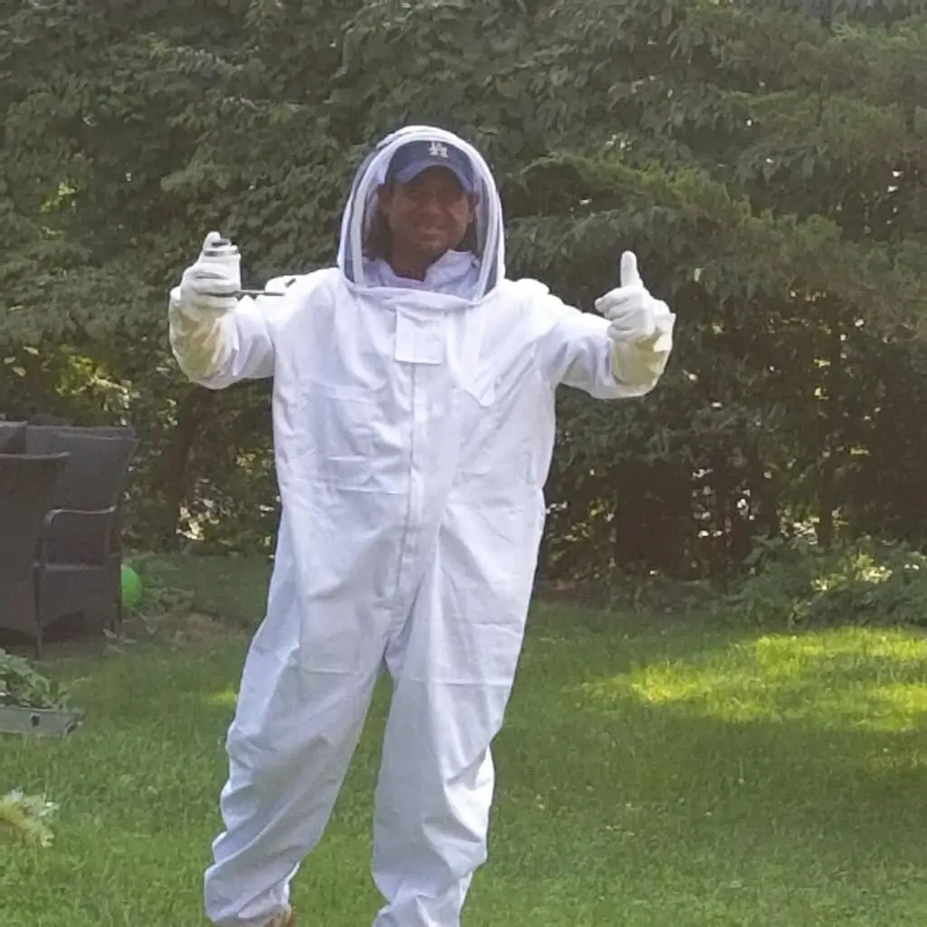 Owner of the company in a pest control suit
